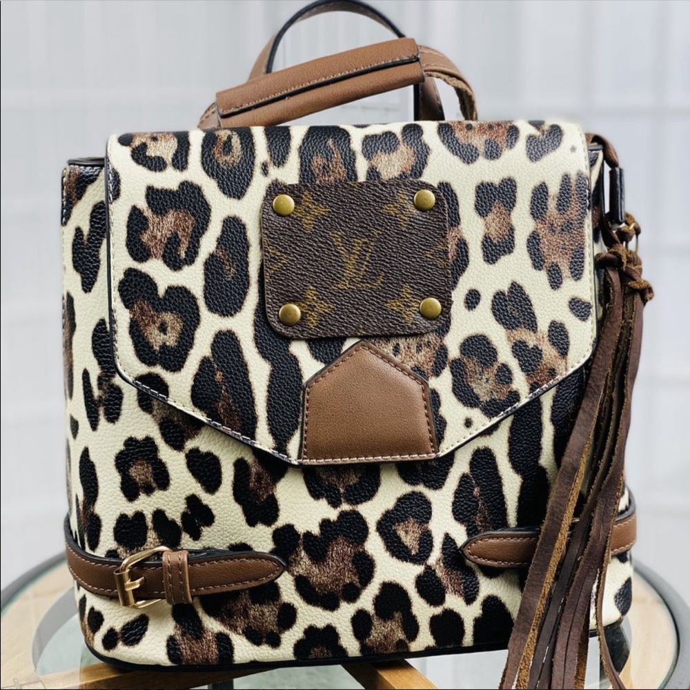 Authentic upcycled Lv cheetah backpack/crossbody